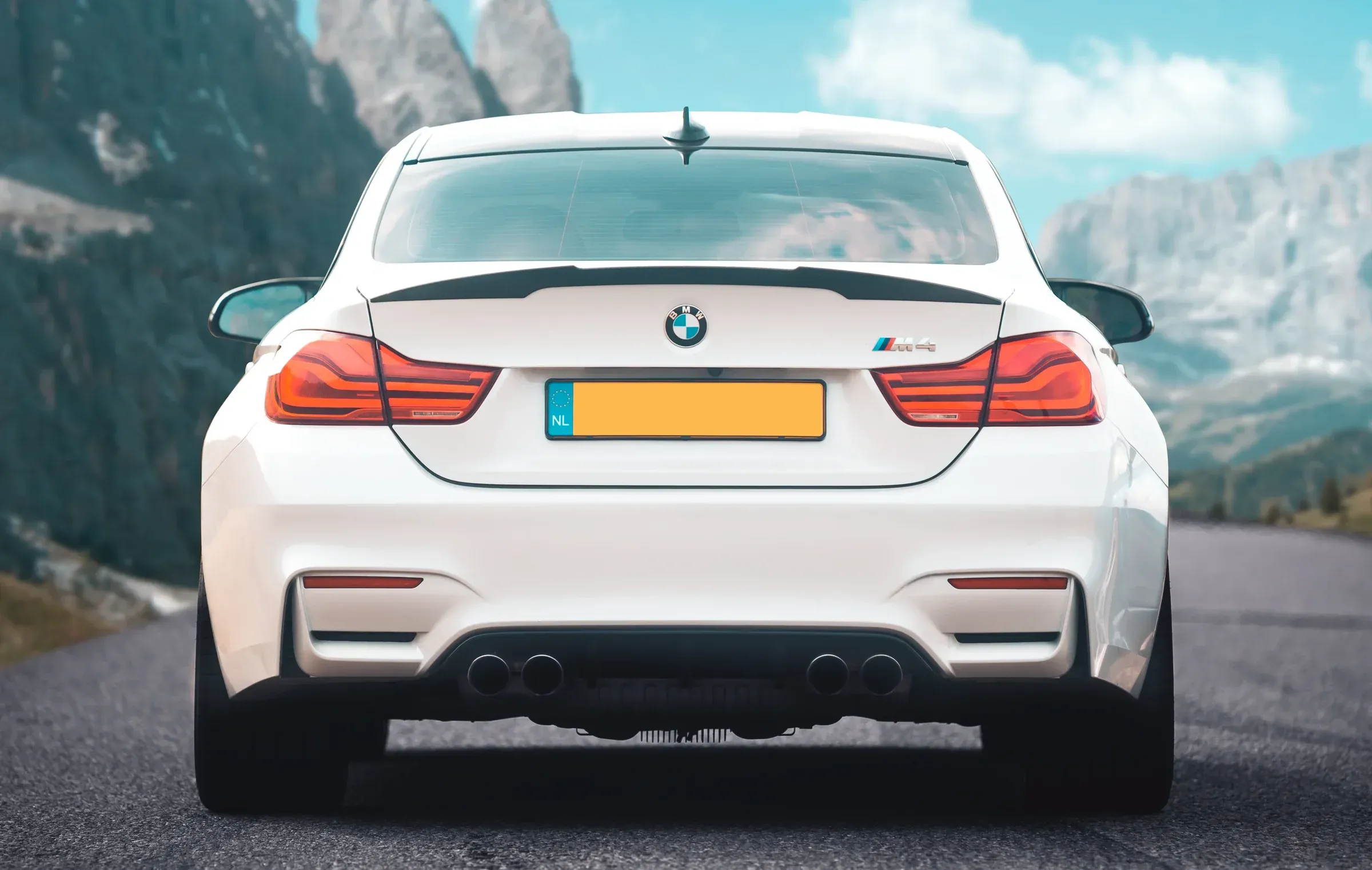 White BMW M4 with crisp mountain-light grading, clean and airy atmosphere